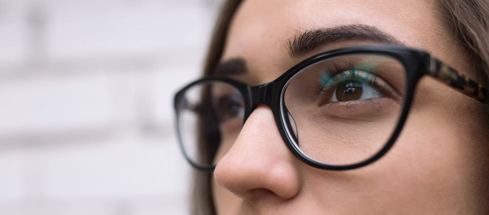 woman with brown eyes wearing glasses