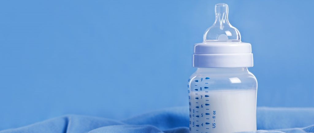 baby bottle filled with milk