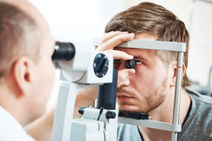 male patient under eye vision examination