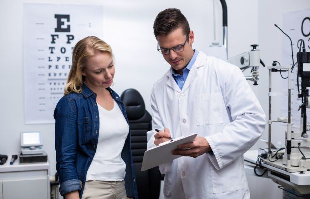 optometrist talking to a patient