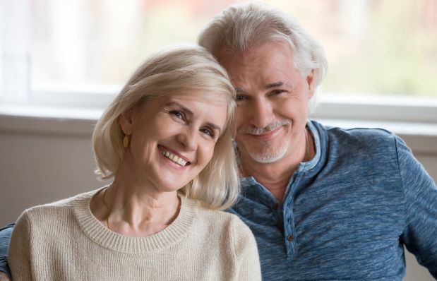 smiling older couple after refractive lens exchange