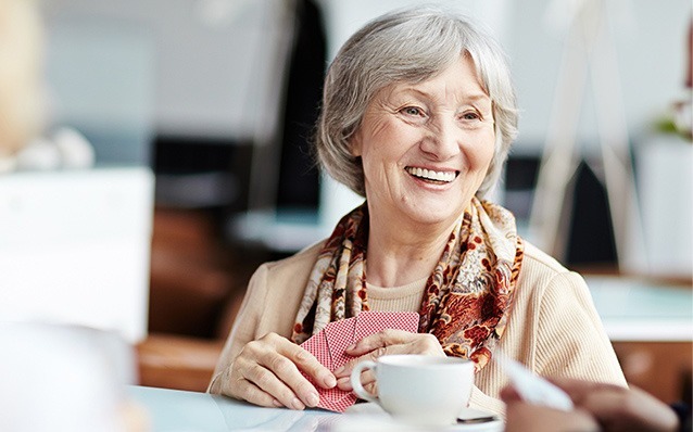 Senior woman smiling after cataract treatment