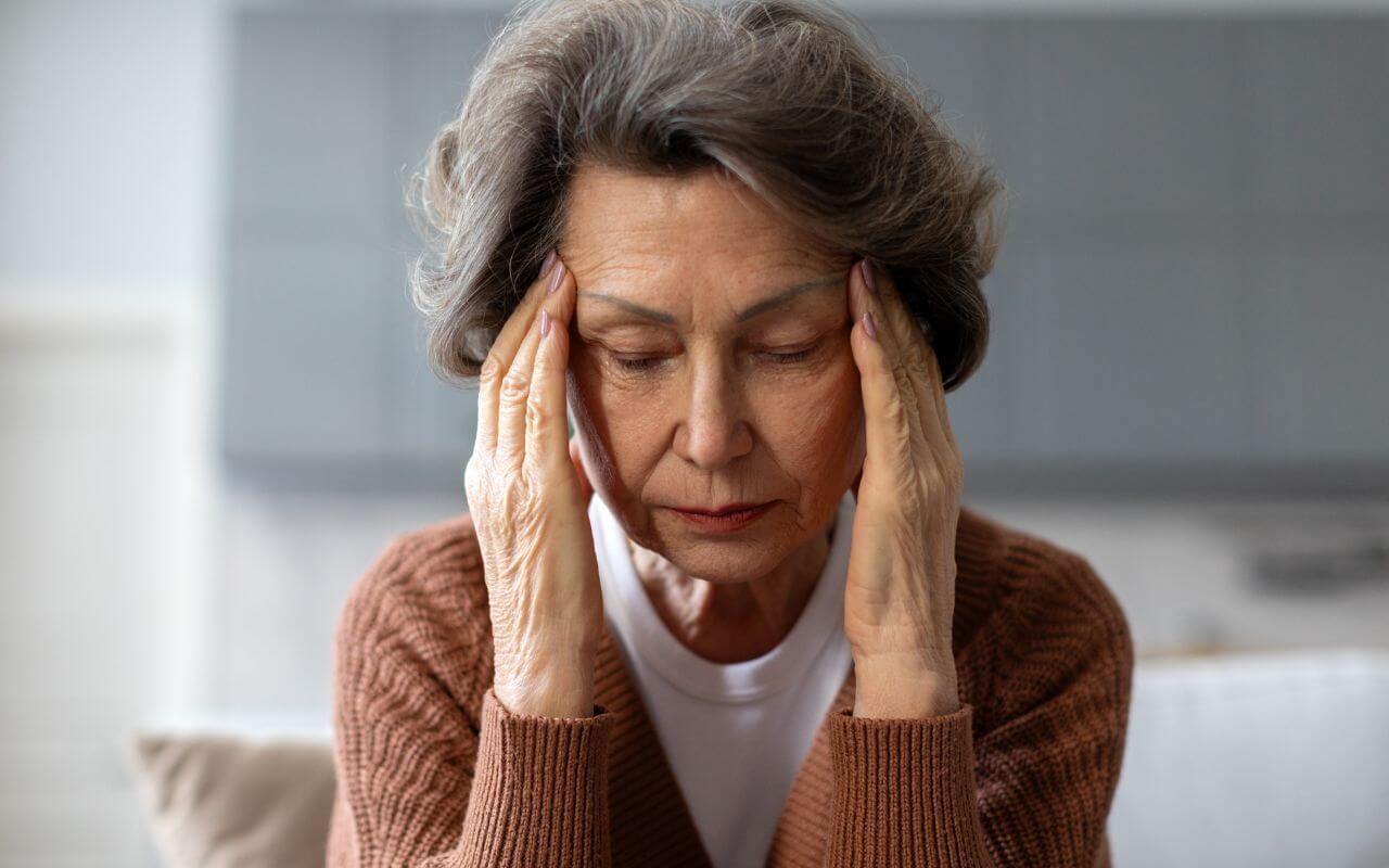 senior woman having discomfort from glaucoma