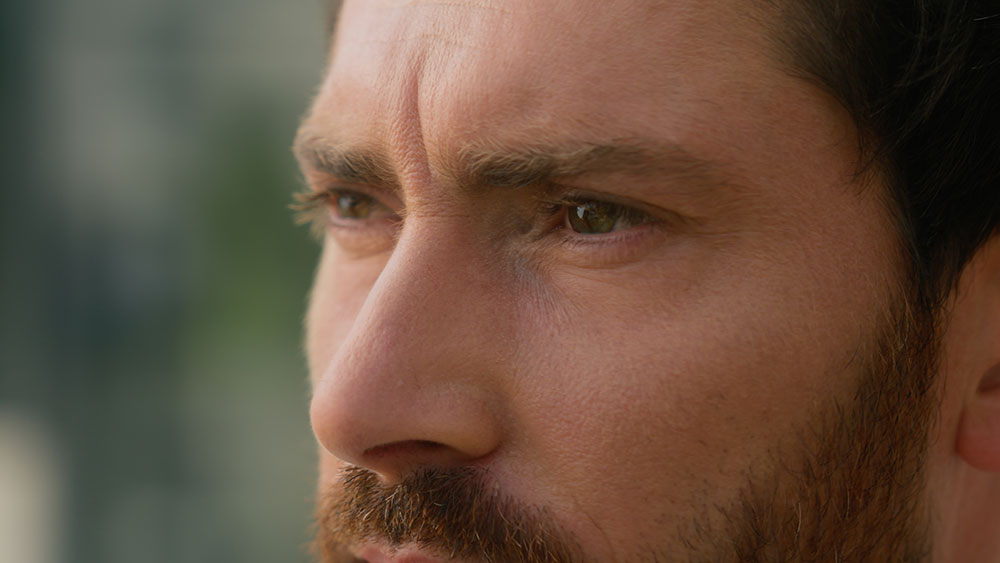 Close-up of a middle-aged man with a serious expression